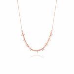 rose gold arrow bead necklace on white background