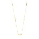 yellow gold square station necklace on white background