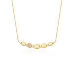 yellow gold cushion curve necklace on white background