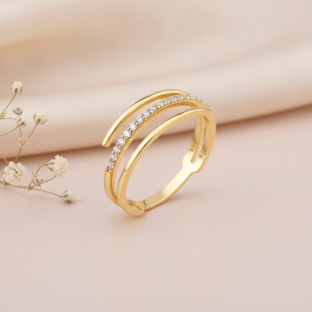 gold wrap ring with a row of pave stones styled with dried flowers on a blush background