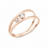 rose gold open double-band ring with two bezel-set clear stones on white background