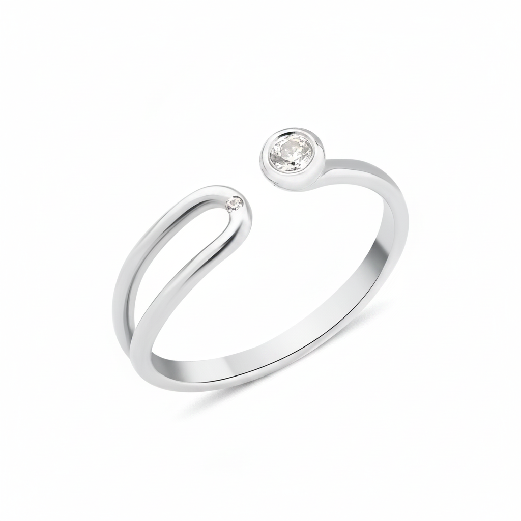 white gold open bypass ring with a bezel-set round stone and a small accent stone on white background