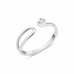 white gold open bypass ring with a bezel-set round stone and a small accent stone on white background