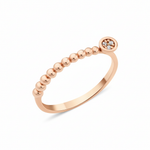 rose gold beaded ring with a round cluster of White CZ stones on white background