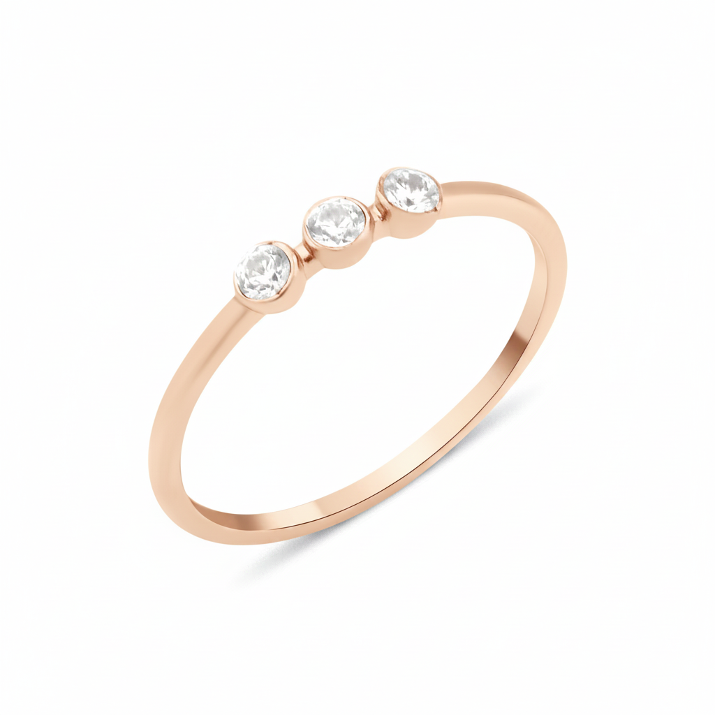 rose gold slim ring with three bezel-set White CZ stones in a row on white background