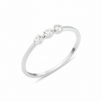 white gold slim ring with three bezel-set White CZ stones in a row on white background