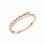 rose gold ring with an elevated linear row of White CZ stones on white background