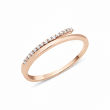 rose gold ring with an elevated linear row of White CZ stones on white background