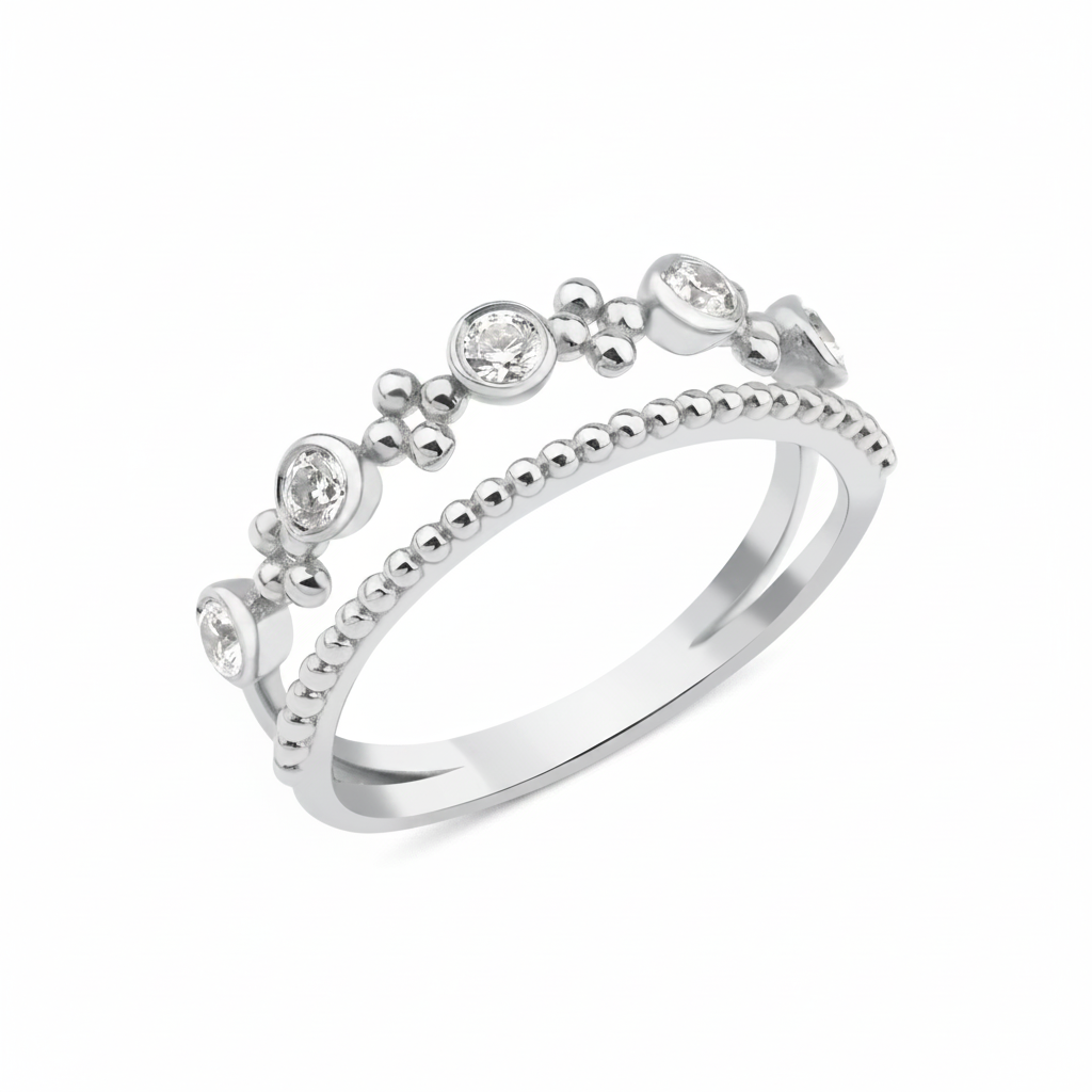 white gold double-band ring with a beaded strand, bezel-set stones, and polished gold spheres on white background