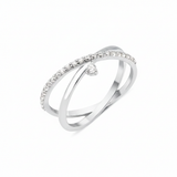 white gold crossover ring with a paved band and a single suspended clear stone on white background