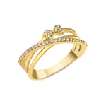 yellow gold crossover ring with a pave strand and twin heart motifs set with clear stones on white background