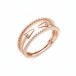 rose gold multi-strand ring with beaded, pave, and cone-tipped bands on white background