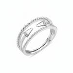 white gold multi-strand ring with beaded, pave, and cone-tipped bands on white background
