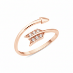 rose gold arrow-shaped open ring with a pave chevron fletching on white background