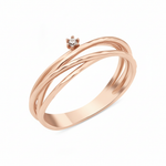 rose gold ring with three organic woven strands and a single prong-set stone on white background