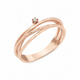 rose gold ring with three organic woven strands and a single prong-set stone on white background