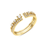 yellow gold open ring with an elevated stone and a geometric pave crown on white background
