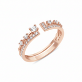rose gold open ring with an elevated stone and a geometric pave crown on white background