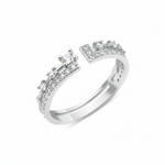 white gold open ring with an elevated stone and a geometric pave crown on white background