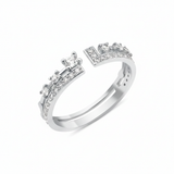 white gold open ring with an elevated stone and a geometric pave crown on white background