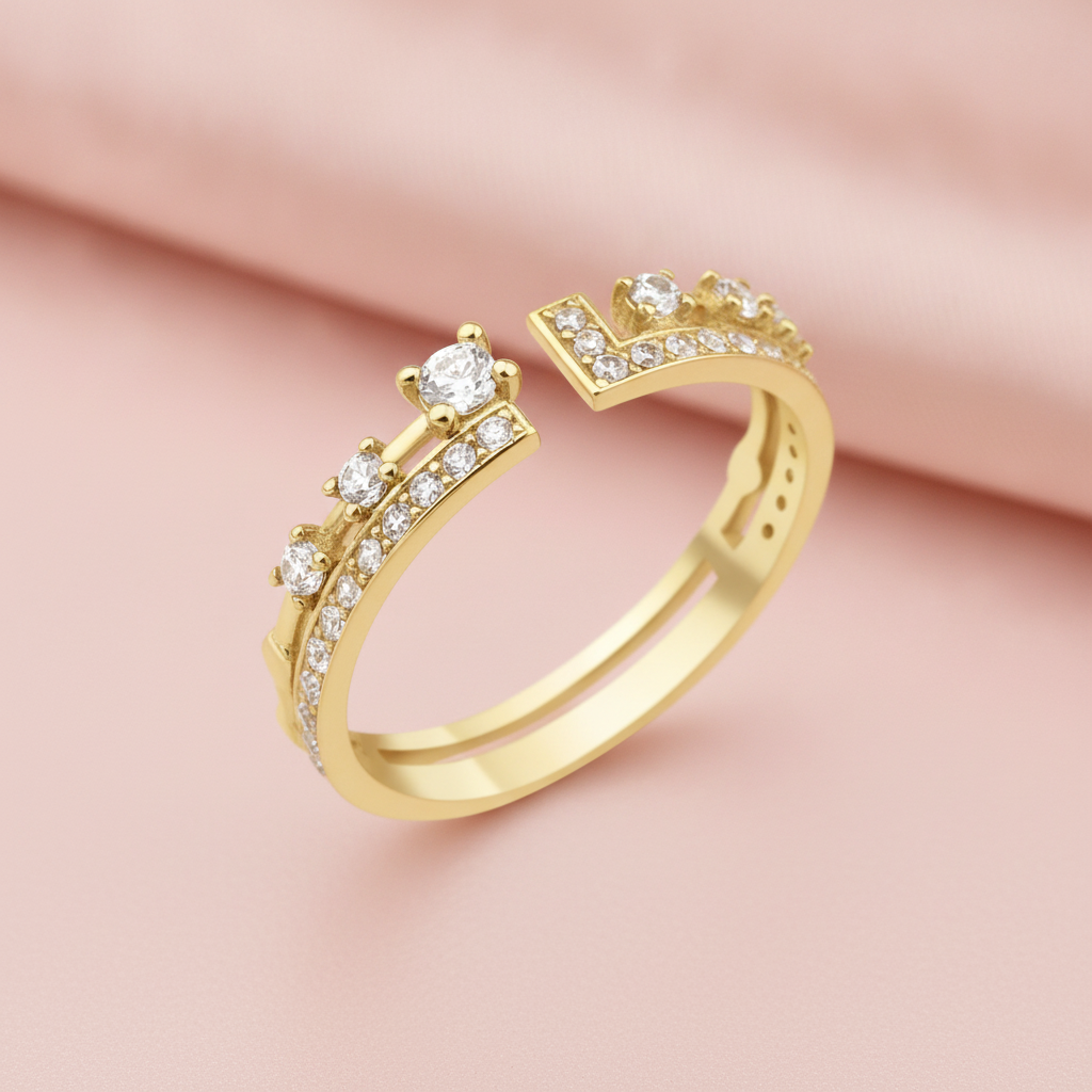 open gold ring with an elevated stone and a geometric pave crown, styled with a white rose on a blush background