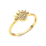 yellow gold sunburst ring with a pave stone cluster and radiant rays on white background