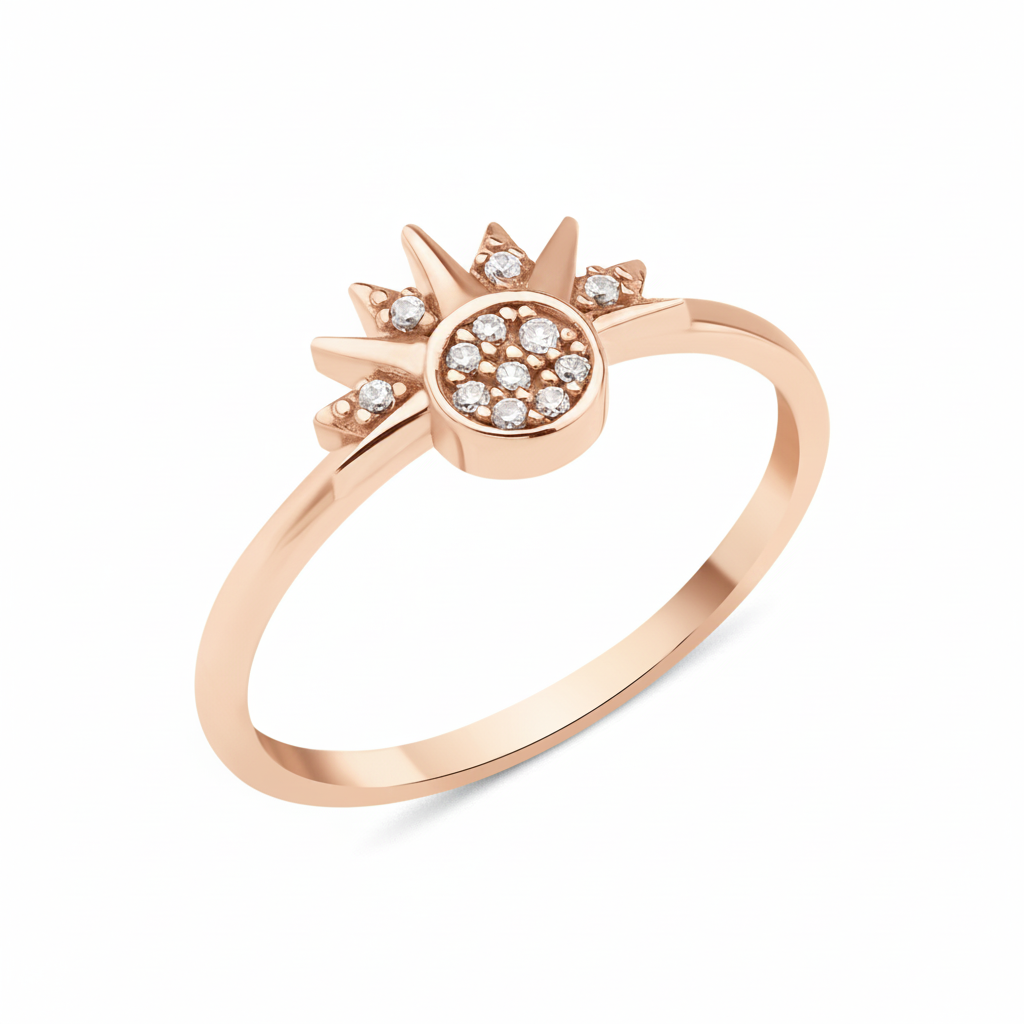 rose gold sunburst ring with a pave stone cluster and radiant rays on white background
