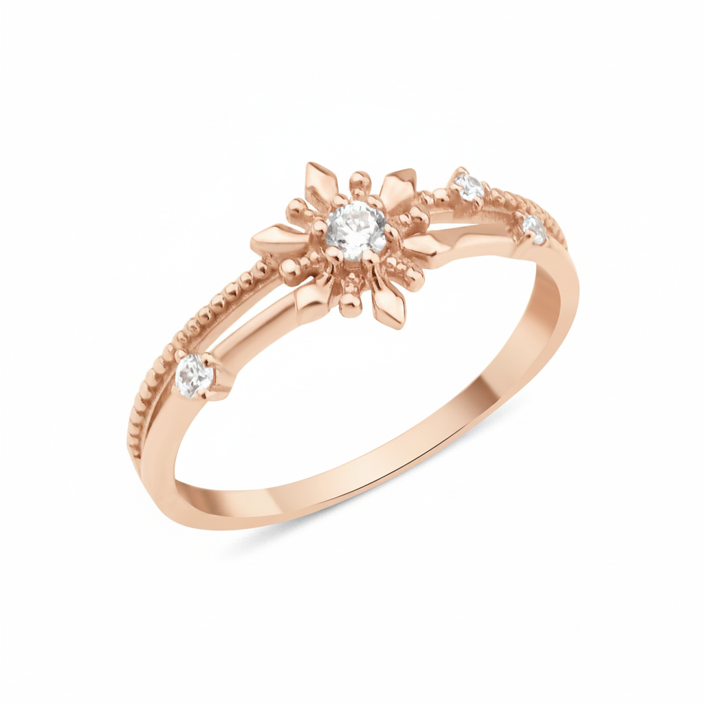 rose gold ring with a sunburst motif, central clear stone, and beaded band on white background