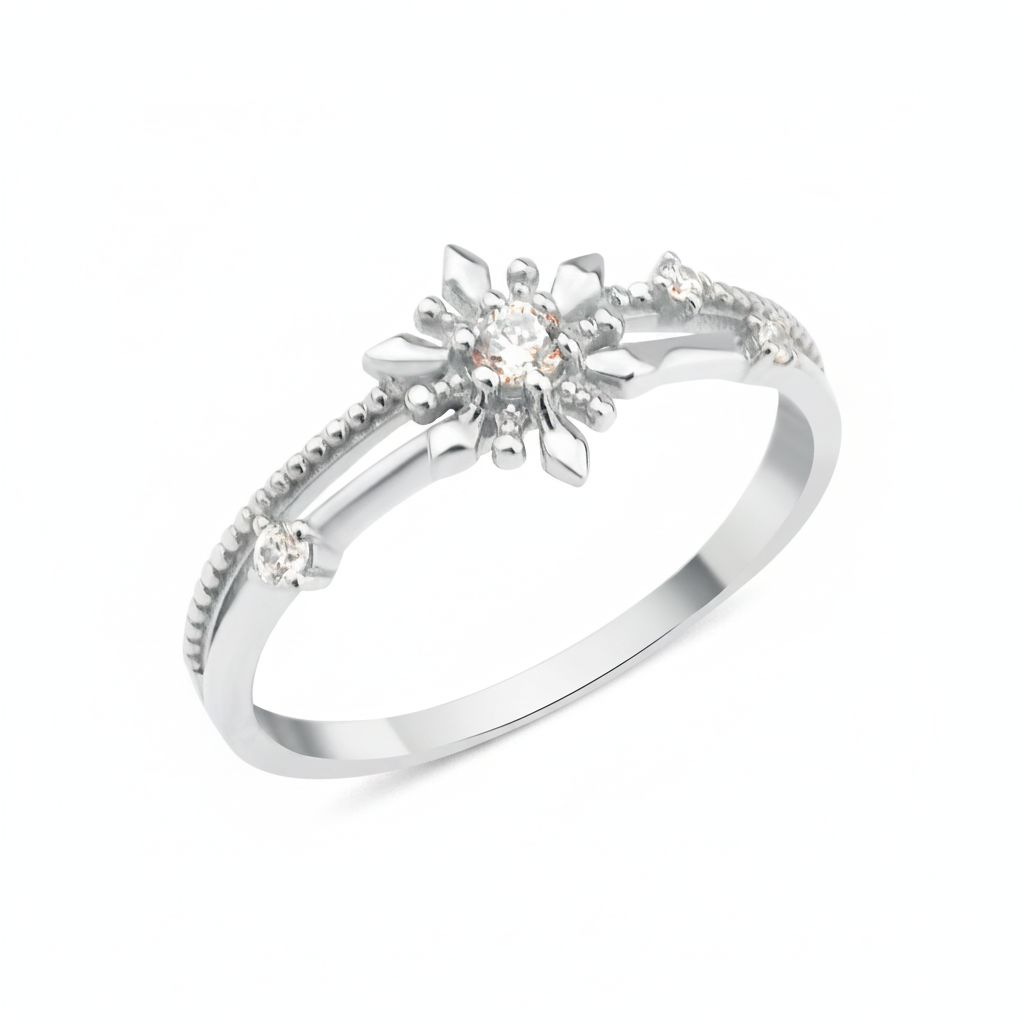 white gold ring with a sunburst motif, central clear stone, and beaded band on white background