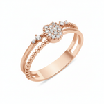 rose gold dual-band ring with a pave heart motif and accent stones on white background