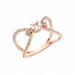 rose gold open bow-shaped ring with pave loops and a marquise-cut stone cluster on white background