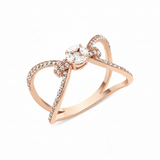 rose gold open bow-shaped ring with pave loops and a marquise-cut stone cluster on white background