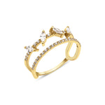 yellow gold open double-band ring with pave stones and marquise-cut accents on white background