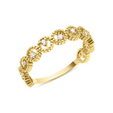 yellow gold ring with linked beaded crowns and White CZ stones on white background