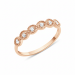 rose gold ring with six round stones in milgrain bezels on white background