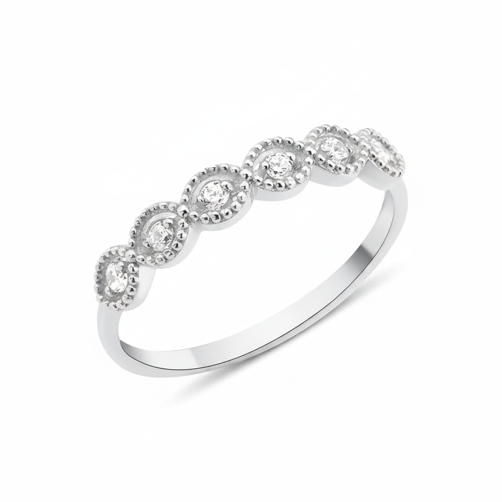 white gold ring with six round stones in milgrain bezels on white background