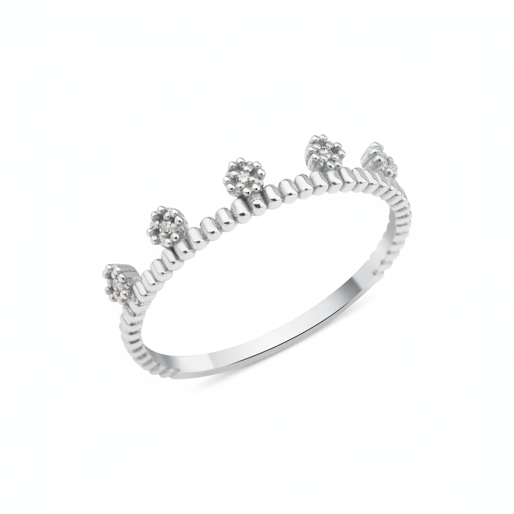 white gold ring with floral crests set with clear stones on a beaded band on white background