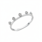 white gold ring with floral crests set with clear stones on a beaded band on white background