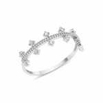 white gold ring with staggered clear prong-set stones on a beaded band on white background