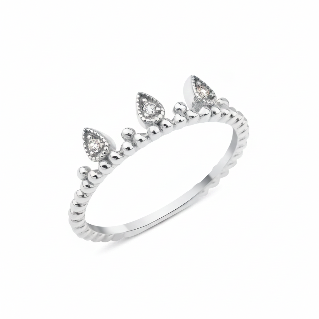 white gold ring with three teardrop crown crests set with clear stones on white background