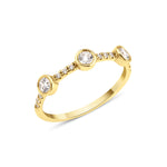 yellow gold twin stone ring on white background