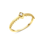 yellow gold beaded chevron ring on white background
