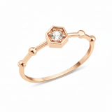 rose gold hexagon bead ring on white background