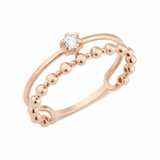 rose gold smooth beaded ring on white background