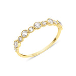 yellow gold rising cadence ring on white background