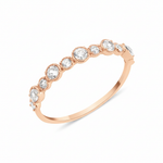 rose gold rising cadence ring on white background