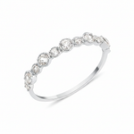white gold rising cadence ring on white background