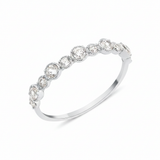 white gold rising cadence ring on white background