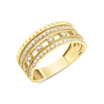 yellow gold ribbed statement ring on white background