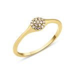 yellow gold domed pave ring on white background